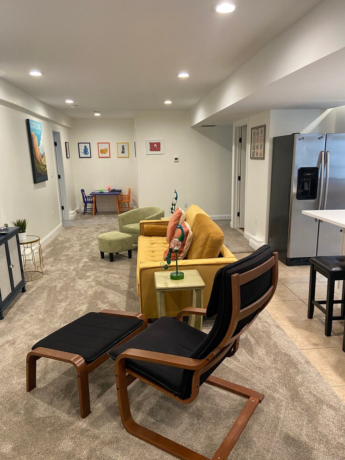 Spacious basement featuring stylish furniture and decor