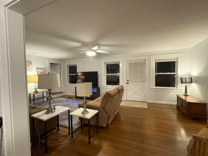 Spacious living area with hardwood floors