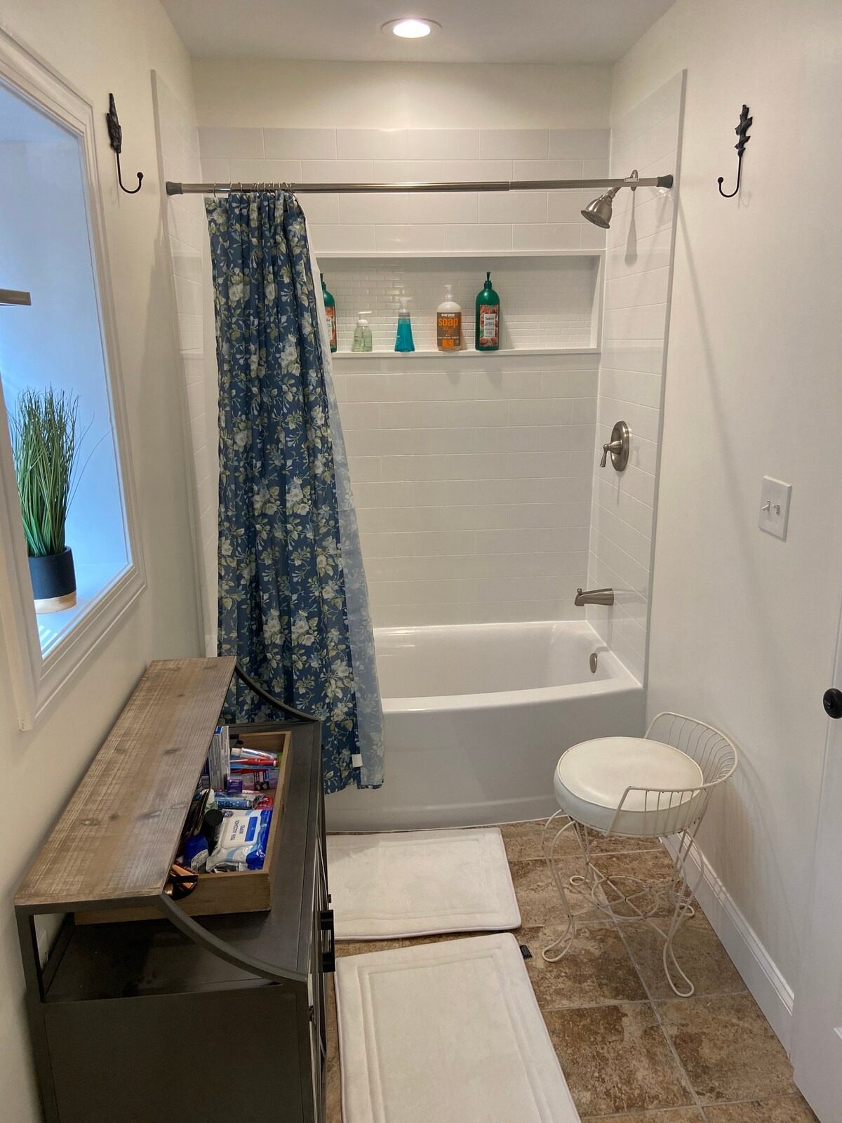 Bathroom with blue floral shower curtain