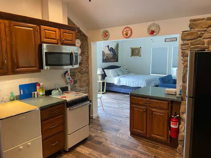 Rustic kitchen leading to a bedroom