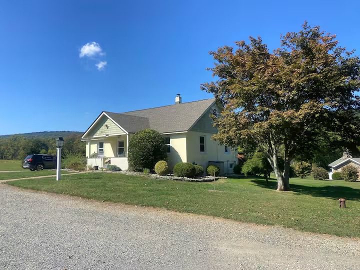 House with tree and gravel path